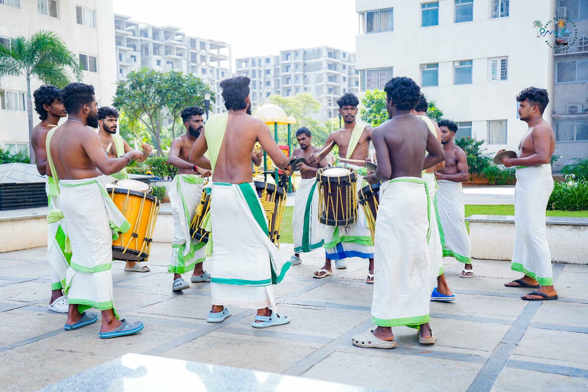 Chenda melam artists performing at a PMWA Onam celebration in PBEL City
