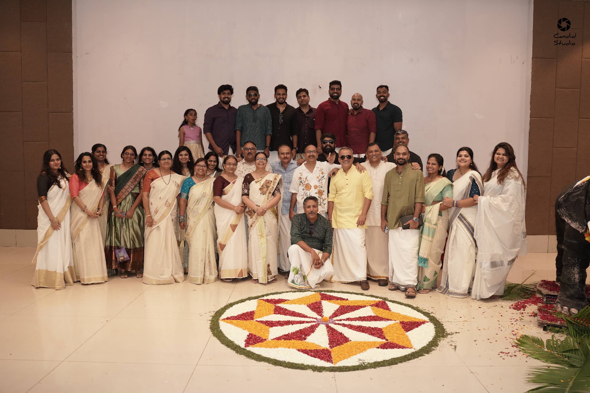 PMWA residents in traditional Kerala kasavu attire at the Onam celebration in PBEL City