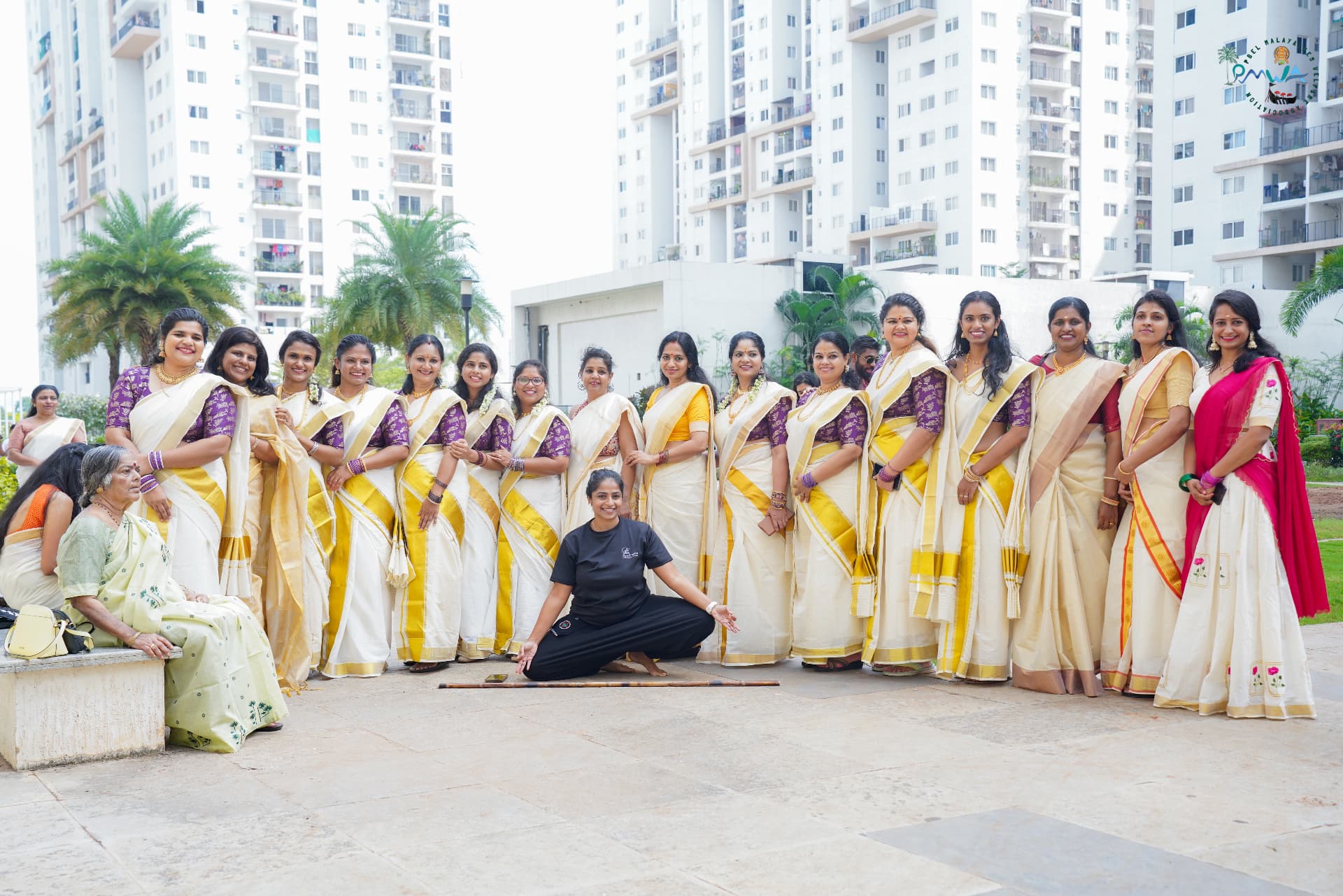 PMWA women in kasavu sarees before a Thiruvathira performance